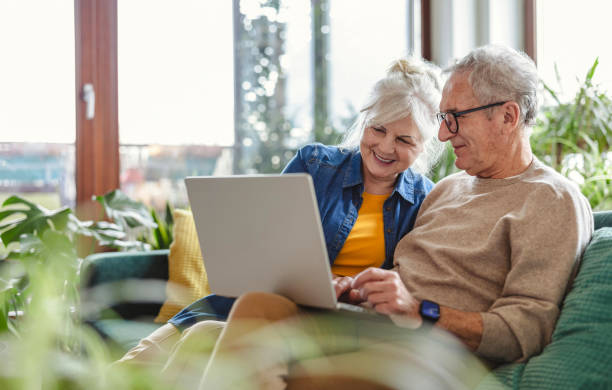 elder couple reviewing their long term care options, and discussing the need to update their will
